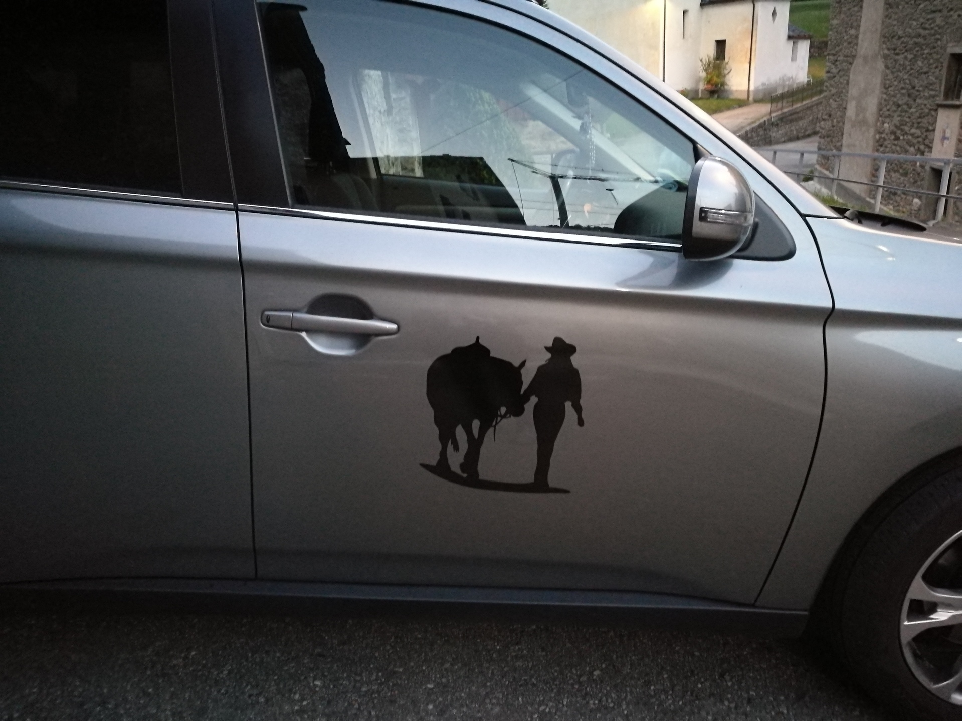 Vescovi's photograph of their Cowgirl Walking Her Horse Sticker