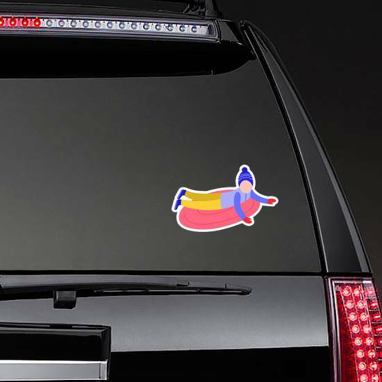 Flat Boy Kid In Hat Sledging At Inflatable Tube Sticker on a Rear Car Window example