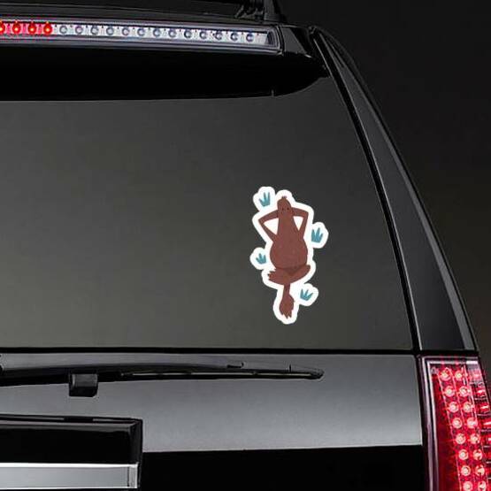 Bigfoot Lying on the Grass Dreaming Sticker on a Rear Car Window example