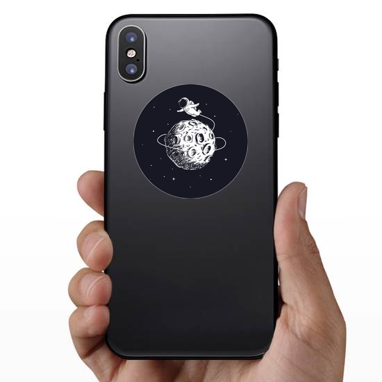 Astronaut Flying Around the Moon Sticker