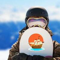 Pirate Ship at Sunset Sticker on a Snowboard example