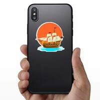 Pirate Ship at Sunset Sticker on a Phone example