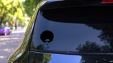 70s Man Face With Frizzy Hair Sticker on a Rear Car Window (New) example