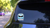 A Cartoon Illustration Of A Jellyfish Smiling Sticker on a Rear Car Window (New) example
