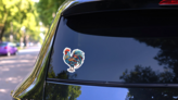 A Colored Rooster Engraving Style Sticker on a Rear Car Window (New) example
