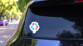 A Fiji Flag Illustration Inside A Recycling Icon Sticker on a Rear Car Window (New) example