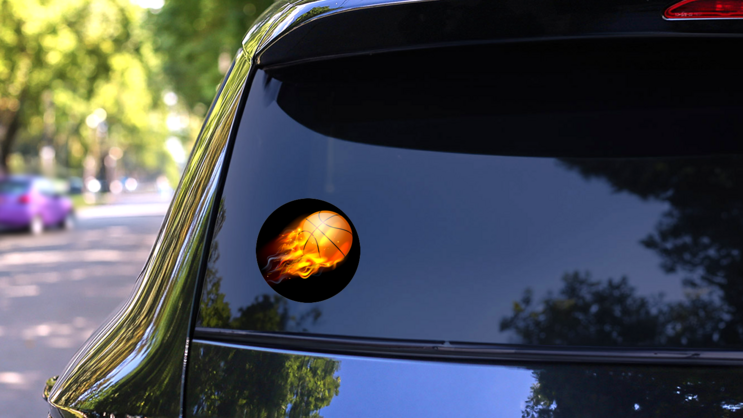 A Flaming Basketball Ball On Fire Flying Through The Air Sticker on a Rear Car Window (New) example