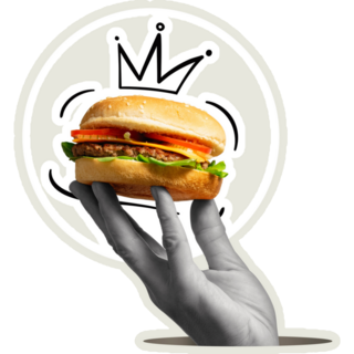 A Hand Holds A Burger King Sticker
