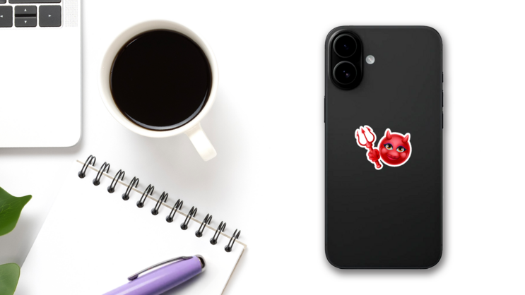 A Red Devil Emoticon Sticker on a Phone (New) example