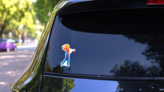 Abstract Golf Player From Splash Of Watercolors Sticker on a Rear Car Window (New) example