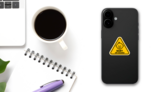 Adorable Baby on Board Triangle Sticker on a Phone (New) example