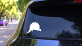 Adorable Stegosaurus Dinosaur Sticker on a Rear Car Window (New) example