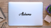 Alabama State Lettering Sticker on a Laptop (New) example