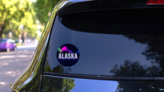 Alaska Vintage Lettering On Black Neon Coloring Sticker on a Rear Car Window (New) example