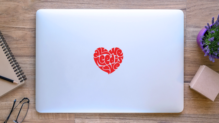 All We Need is Love Typography Heart Transfer Sticker on a Laptop (New) example