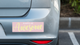 Always Be Awesome Bumper Sticker on a Grey Car Bumper example