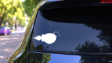 Angler Fish Swimming Sticker on a Rear Car Window (New) example
