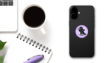 Angry Crow Carrying Bone Illustration On Purple Sticker on a Phone (New) example