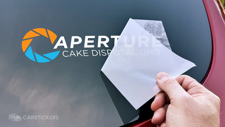 Printed transfer decal being applied on car window