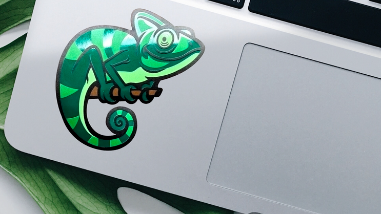 Reflective background sticker applied to laptop.