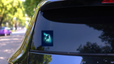 Astronaut Floating Through Space Sticker on a Rear Car Window (New) example