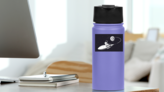 Astronaut Surfing on a Spaceship Sticker on a Water Bottle (New) example