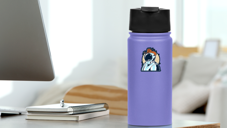 Astronaut Wearing Cowboy Hat Sticker on a Water Bottle (New) example