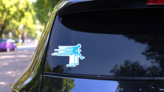 Athlete Man Hurdling In Track And Field Blue Sticker on a Rear Car Window (New) example