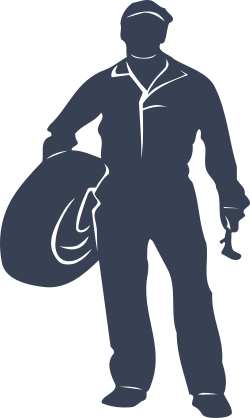 Automotive Mechanic Holding A Tire Sticker