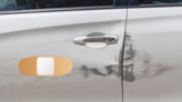 Band Aid Bandage Upside Down Sticker on a Scratched Car example