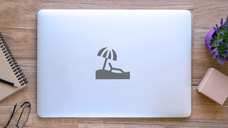 Beach Icon With Umbrella And Chair Sticker on a Laptop (New) example