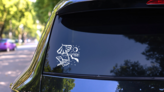 Beach Scene With Umbrella And Chair Sticker on a Rear Car Window (New) example