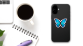 Beautiful Blue And Black Butterfly Sticker on a Phone (New) example
