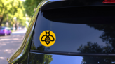 Bee Concept Logo On Yellow Sticker on a Rear Car Window (New) example
