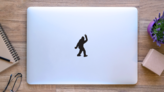 Bigfoot Throwing Peace Sign Sticker on a Laptop (New) example