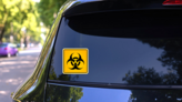Biohazard Sign, Biohazard Sign In Yellow Sticker on a Rear Car Window (New) example