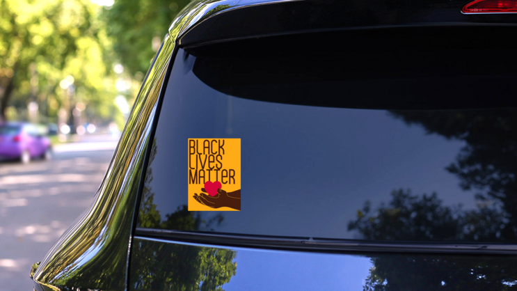 Black Lives Matter Hand With Heart Sticker on a Rear Car Window (New) example