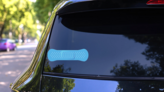 Blue Band Aid Bandage Sticker on a Rear Car Window (New) example
