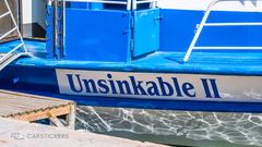 A decal on a boat with the name Unsinkable II.