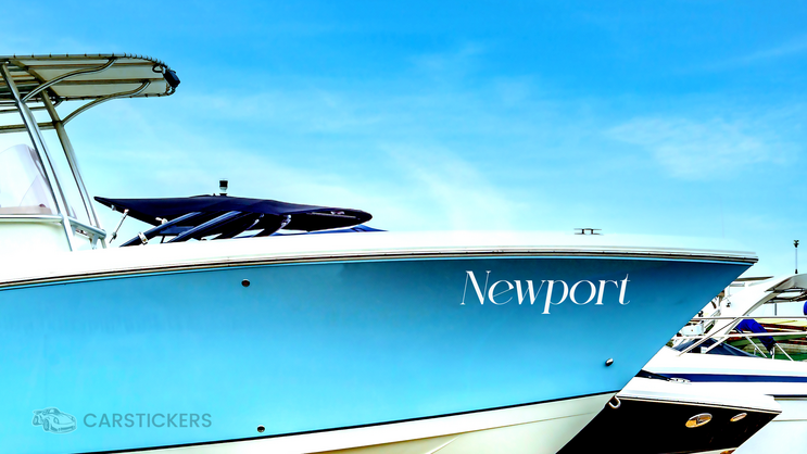 A decal on the side of a boat with the name of a port.