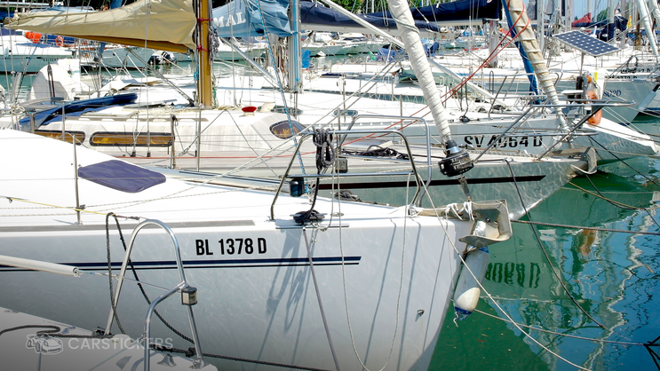 Registration decals on the side of boats.