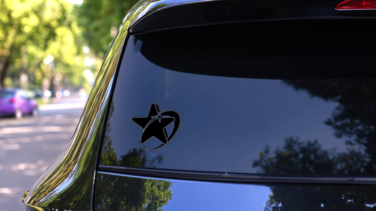 Bold 2000s Style Star Sticker on a Rear Car Window (New) example