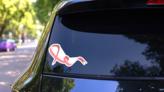 Breast Cancer Awareness Month Ribbon Art Sticker on a Rear Car Window (New) example