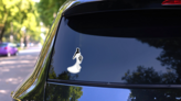Bride Holding Flowers In Left Hand Sticker on a Rear Car Window (New) example