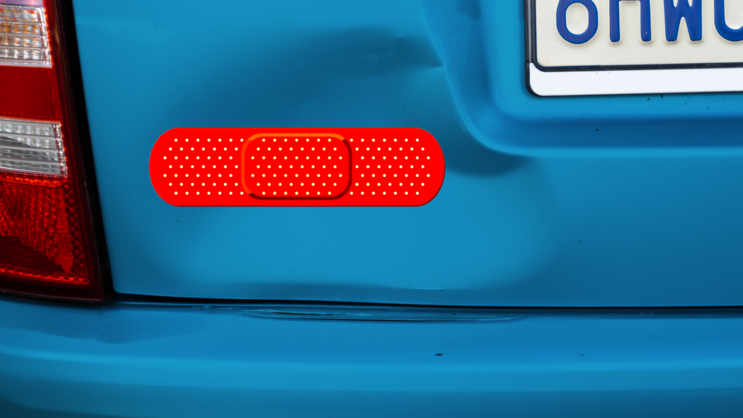 Bright Red Band Aid Bandage Sticker on a Dented Car example