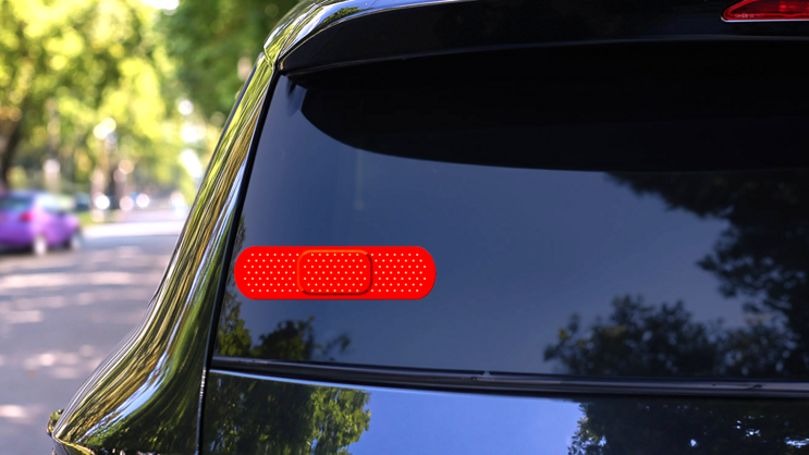 Bright Red Band Aid Bandage Sticker on a Rear Car Window (New) example