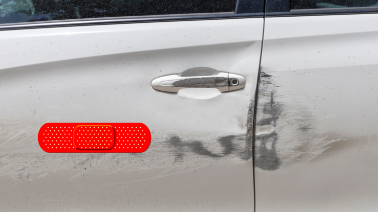 Bright Red Band Aid Bandage Sticker on a Scratched Car example