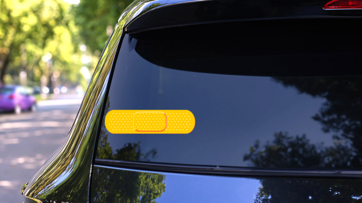 Bright Yellow Band Aid Bandage Sticker on a Rear Car Window (New) example