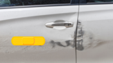 Bright Yellow Band Aid Bandage Sticker on a Scratched Car example