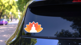 Buddha Illustrated With A Lotus Background Sticker on a Rear Car Window (New) example